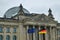 Reichstag building with German and EU Flags