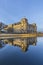 Reichstag with reflection in river Spree