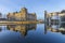 Reichstag with reflection in river Spree