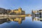 Reichstag with reflection in river Spree