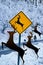 Reindeer Crossing at Christmas with an unexpected twist as these deer cross the wintery highway.