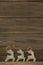 Reindeer decorations against wooden plank