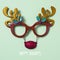 Reindeer eyeglasses and text happy holidays