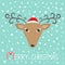 Reindeer head in Santa Claus hat. Merry christmas. Candy