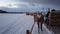 Reindeers pulling sleighs in winter Sami camp