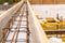 Reinforced belt in wooden formwork at a construction site close up