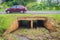 Reinforced concrete box culverts under the asphalt road. Box culvert is a structure that allows water to flow under