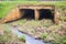 Reinforced concrete box culverts under the asphalt road. Box culvert is a structure that allows water to flow under