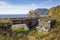 Reinforced concrete bridge on stone abutments across the Dark-1 stream on the shore of Baikal lake