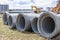 Reinforced concrete storm sewer pipes of large diameter stacked at a construction site. Sewer Large diameter pipes. Wastewater