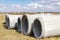 Reinforced concrete storm sewer pipes of large diameter stacked at a construction site. Sewer Large diameter pipes. Wastewater