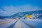 Reinli, Norway - March 26, 2018: Beautiful outdoor view of many wooden houses at Valdres Region in Reinli town, covered