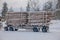 Reinli, Norway - March 26, 2018: Outdoor view of huge truck transport trunks or lumber in a road in Valdres region