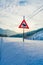Reinly, Norway - March 26, 2018: Outdoor view of sign of moose crossing at one side during winter in the road, with snow