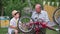 relationship with children, adorable grandfather together with his grandson repair wheel on bicycle during vacation in