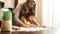 Relatives making cookies from dough with mold