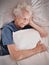 Relax, bedroom and old woman sleeping in peace resting in a house or home dreaming with a soft pillow in hand. Bedding