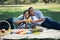 Relax couple black people with orange juice in garden