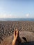 Relax feet against blue sky over the sea. Background of relaxation feet on wood, enjoying the sunlight in the beach.