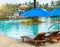 Relax by The Pool in Luxury Hotel on The Island of Thailand. Couple of Wooden Chair under The Umbrella