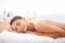 Relax, sleeping and young woman at spa with body massage for health, wellness and self care. Happy, natural and female