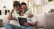 Relax, tablet and black couple with hug on a living room couch with happiness and smile. Series streaming, web and home