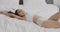 Relax time. Young confident woman with perfect body going and falling down on bed, lying and enjoying linen