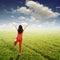 Relax Woman in grenn grass field andblue sky