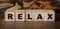 Relax Word Written In Wooden Cubes. Relaxation healthcare concept