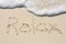 Relax Written in Sand on Beach