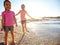 Relax youre on beach time. two little girls having fun on the beach.