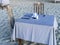 Relaxation awaits on this beautiful sandy beach with a table and chairs set for two