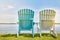 Relaxation awaits. Rearview shot of two empty chairs overlooking a lake.