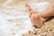 Relaxation on beach, detail of male feet