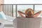 Relaxation healthy living lifestyle summer holiday vacation of freelancer woman take it easy resting in comfort chair in resort