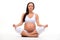 Relaxation and meditation during pregnancy. Young pregnant woman doing yoga