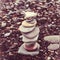 relaxation at sea. Stack of stones on beach nature background. Stone cairn on blurry background, pebbles and stones