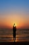 Relaxation silhouette on the beach