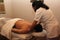 Relaxation in spa. masseur working on relaxing, reductive and therapeutic massage to latin man