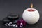 Relaxation and therapy in peace and quiet using the atmosphere of a candle on a black background