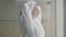 Relaxed adult woman resting in spa hotel. Side view portrait of confident blond lady in bathrobe adjusting hair towel