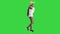 Relaxed african american girl walking wearing a straw hat and a bag on a Green Screen, Chroma Key.