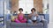 Relaxed african american mother and daughter doing yoga in living room, meditating