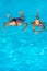 Relaxed on Bahamas or Bermuda - traveling couple. Tropical couple. Sporty man and woman in swimming wear on blue water