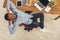 Relaxed black businessman in modern white office