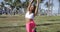Relaxed black woman doing exercise in park