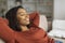 Relaxed Black Woman Enjoying Comfortable Moment on a Sofa at Home