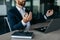 Relaxed businessman meditating at workplace in office, calm male entrepreneur in suit sitting at desk, selective focus