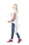 Relaxed confident casual trendy middle age woman walking and looking away. Side view