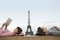 Relaxed Couple With Eiffel Tower In Background